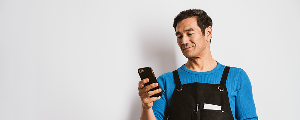 a small business owner on his phone