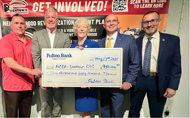 Fulton bank presenting a donation check to ACEA