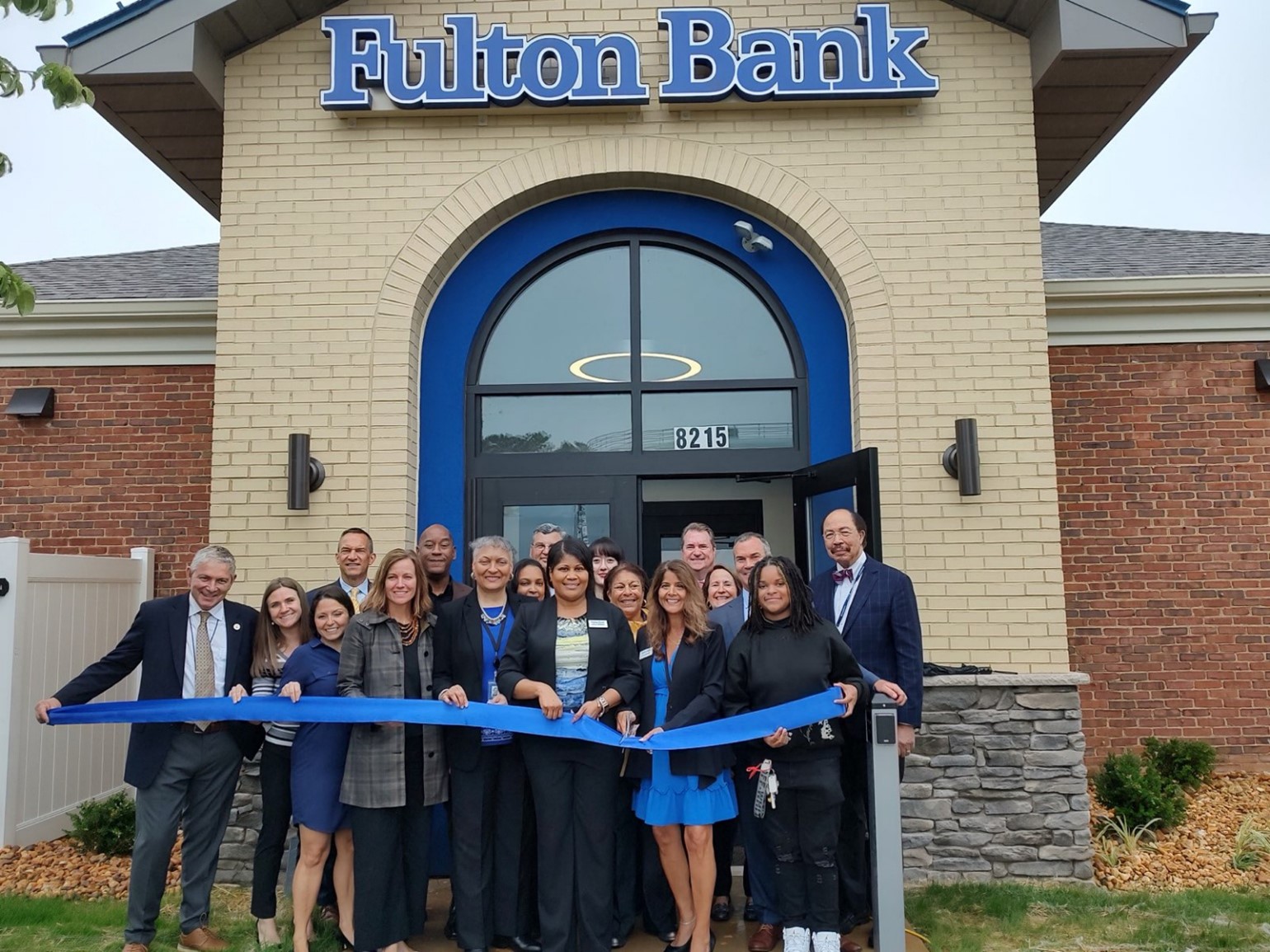 Community leaders join with Fulton Bank team members to cut the ribbon on the new financial center at Parham & Broad.